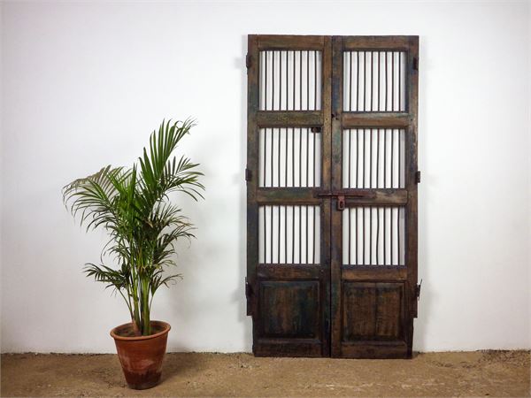 Indian wooden door with metal bar grilles
